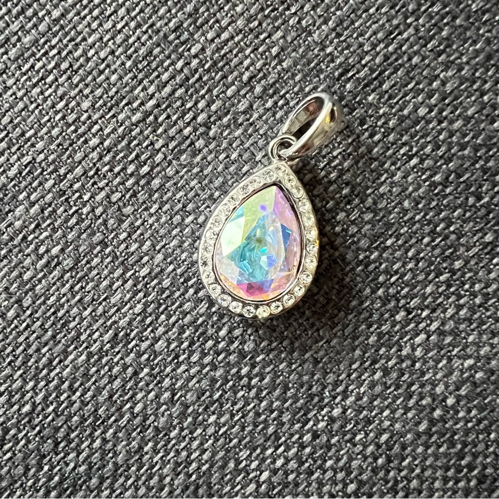 So pretty Silver and crystal pendant surrounded by cubic zirconia stones